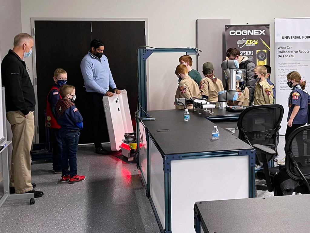A local Cub Scout troop interacts with the latest automation at the FPE Automation Training & Technology Center.