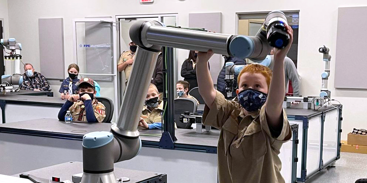 A local Cub Scout troop interacts with the latest automation at the FPE Automation Training & Technology Center.